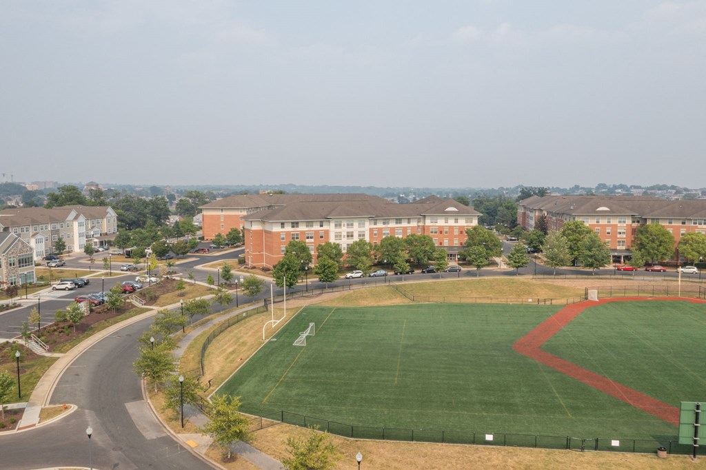 a baseball field in front of a building