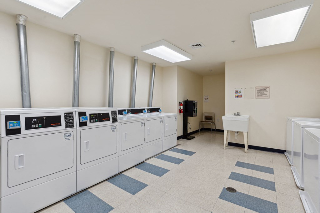 a room filled with washers and dryers