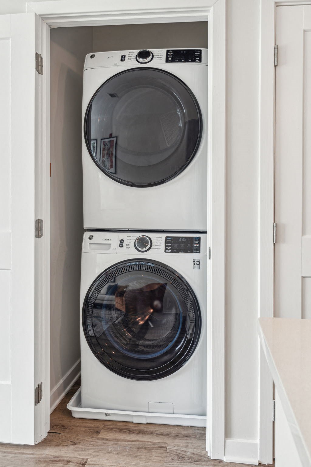 Stacked washer and dryer in a closet at Legacy at Twin Rivers