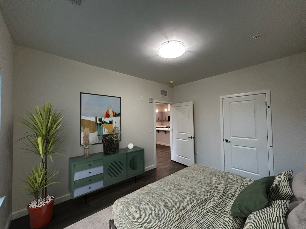 Elegant bedroom space with contemporary touches at Highland Terrace apartments located in Richmond's Highland Park neighborhood