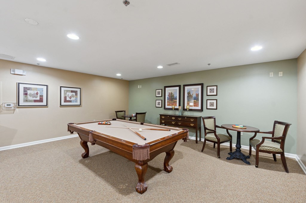 a games room with a pool table and a ping pong table