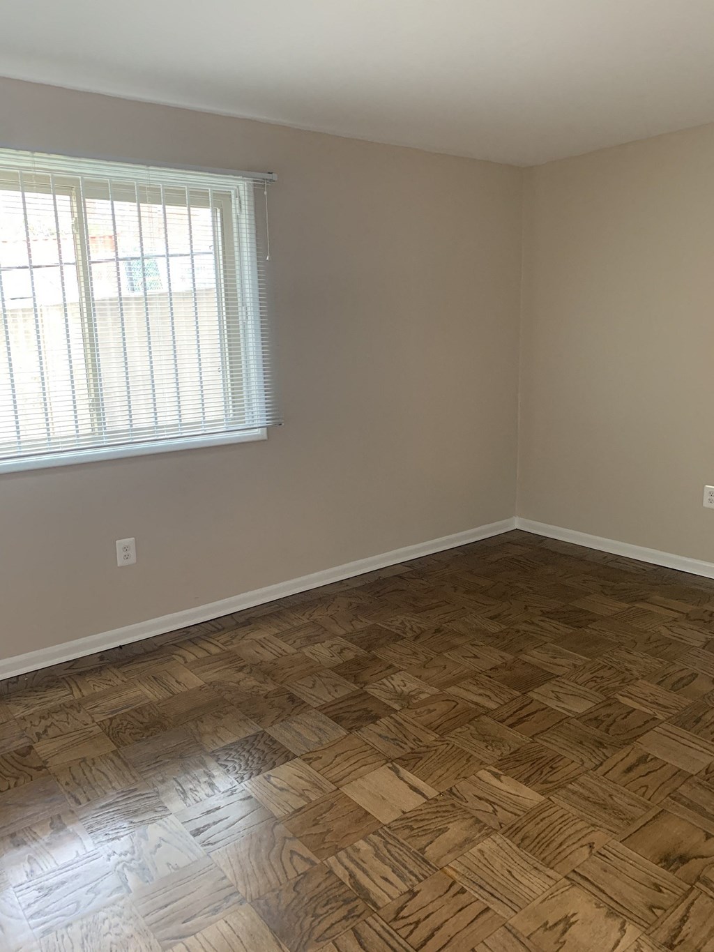 Light-filled bedroom at Randle Hill affordable apartment community located in Washington, DC