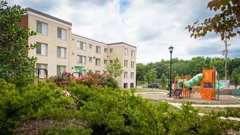 a childrens playground in front of a building