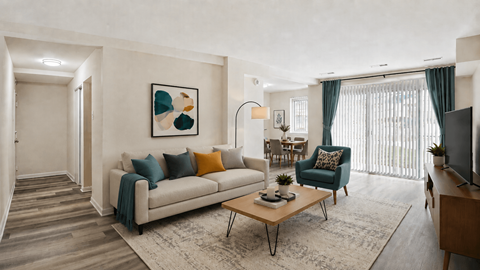 A living room with a couch, armchair, and coffee table.