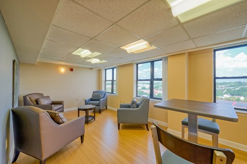 a living room with couches chairs and a table