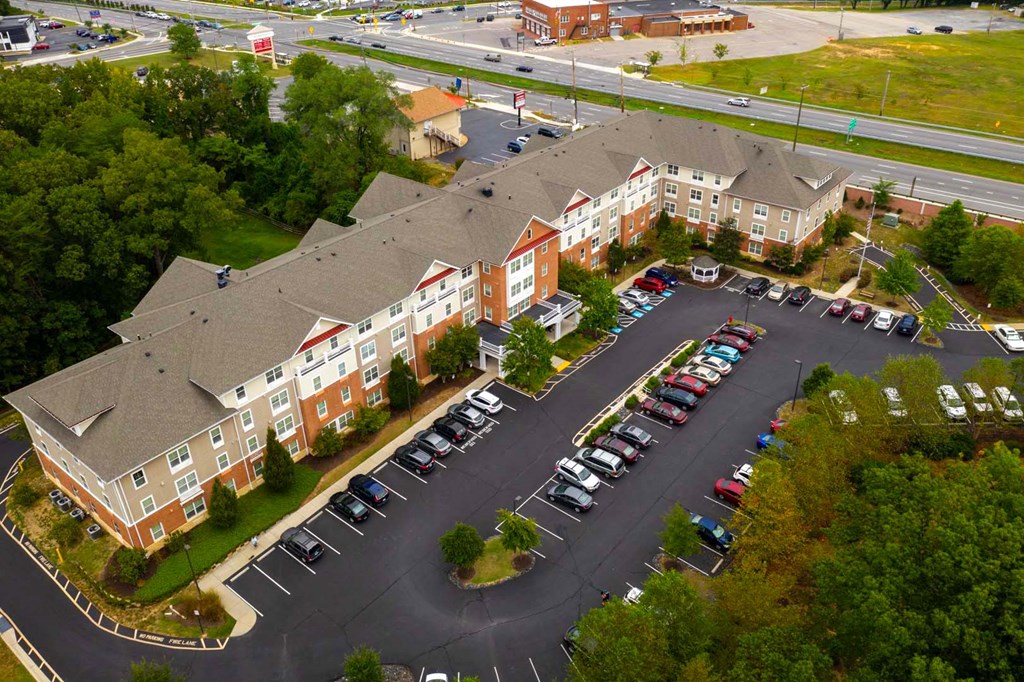 an aerial view of a building and parking lot