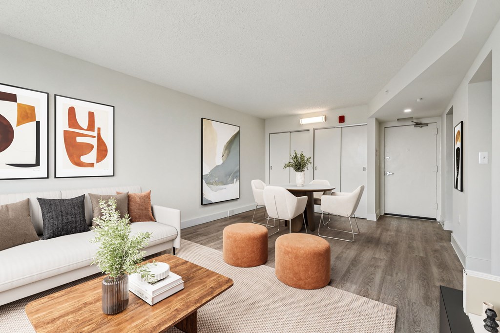 Open-concept layout in a market-rate 2-bedroom apartment at Edgewood Commons 611 & Gardens, combining the kitchen, dining, and living spaces into a seamless and functional living experience.