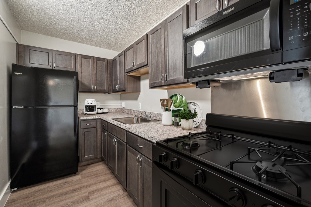 Modern kitchen in a 2-bedroom apartment at Edgewood Commons 611 & Gardens, showcasing energy-efficient appliances, ample cabinet storage, and sleek finishes—offering both style and functionality for everyday living.