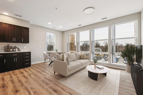 A modern living room with a large couch and a coffee table.
