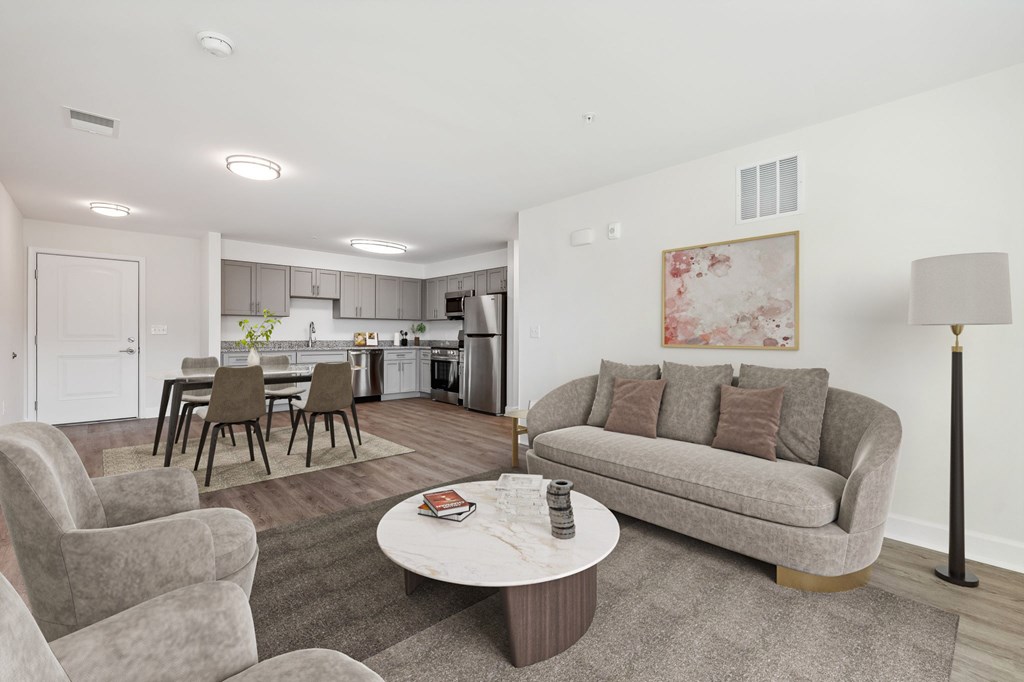 A living room with a grey couch and a coffee table.