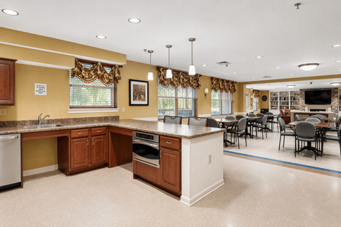 A kitchen with brown cabinets and a white island.