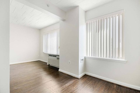 Spacious living room inside a market-rate apartment at Edgewood Commons 601 featuring hardwood floors, bright natural light, and energy-efficient appliances in Washington, DC.