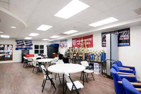 a dining room with tables and chairs and a bar
