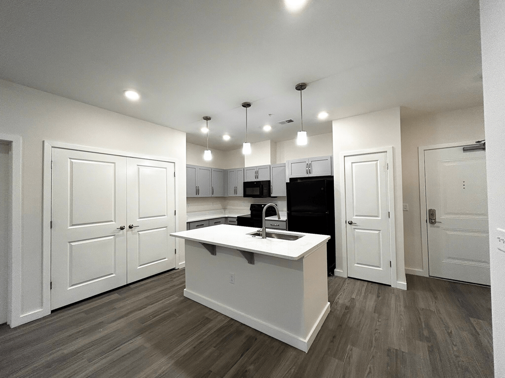 Smart, stylish kitchen with convenient in-home washer/dryer at Highland Terrace apartments located in Richmond's Highland Park neighborhood