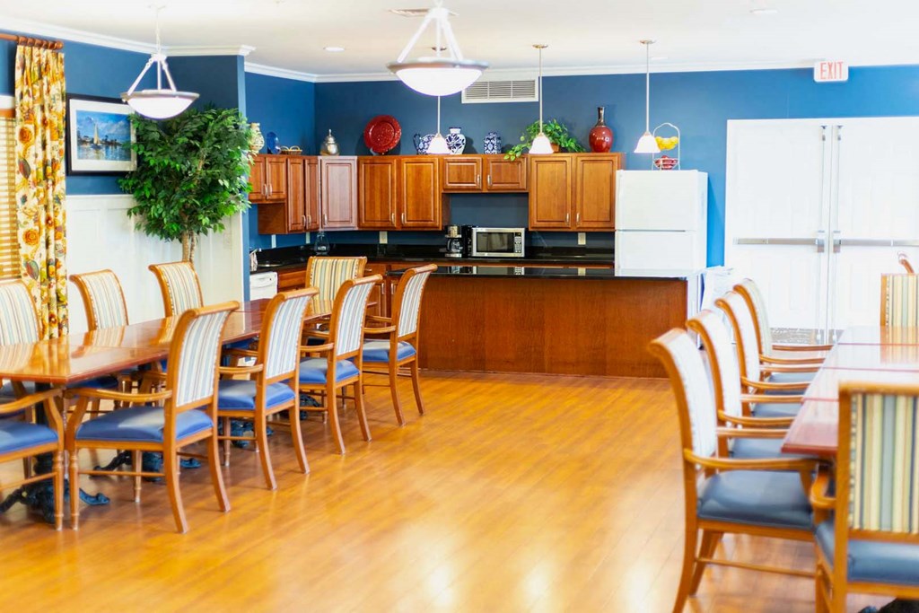 a large kitchen and dining room with a table and chairs