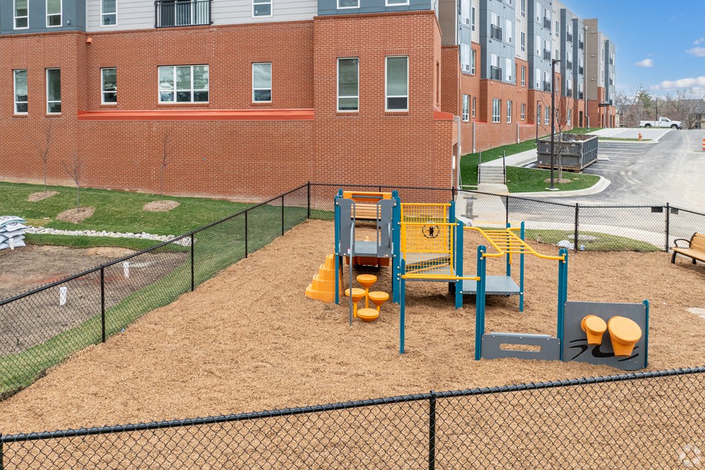the playground at the flats at big tex apartments