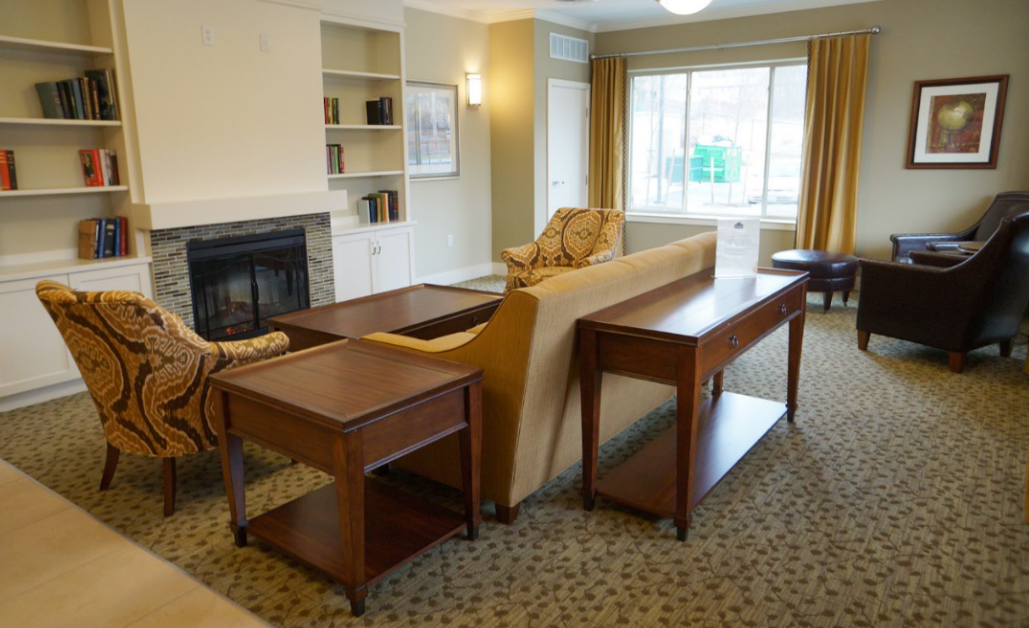 a living room with a couch and tables
