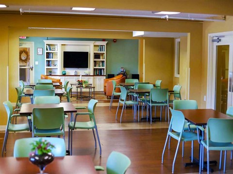 a dining room with tables and chairs