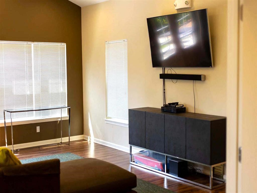 a living room with a tv and a couch