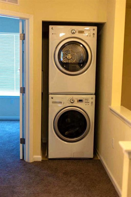 a front loading washer and dryer in a closet