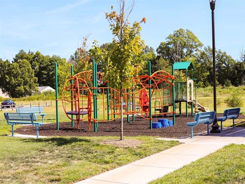 a playground at a park with benches