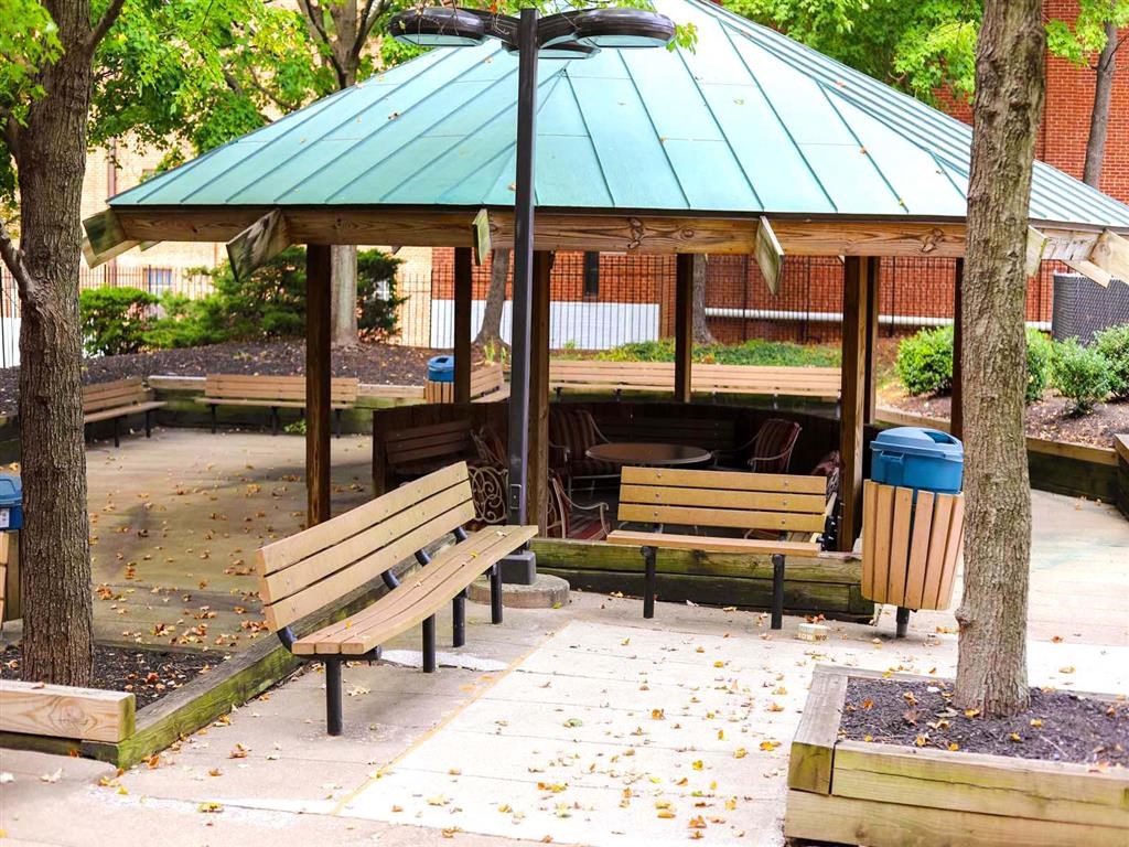 a park with benches and a gazebo