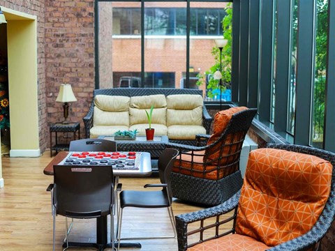 a living room with a couch and chairs and a table