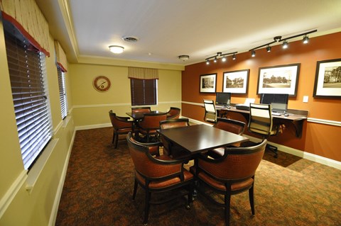 a dining room with a table and chairs