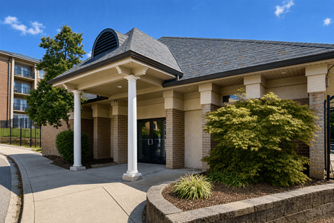 A building with a black roof and white columns.