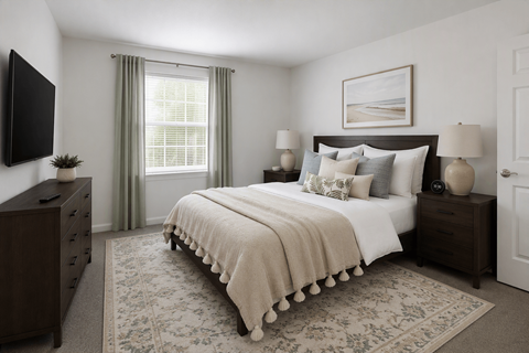 A bedroom with a large bed, a dresser, and a window with curtains.