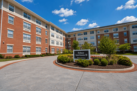 A sign in front of a building that says Ednor Apartments II.