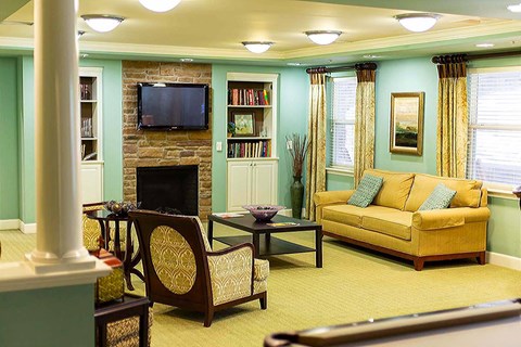 A living room with a fireplace and a couch.