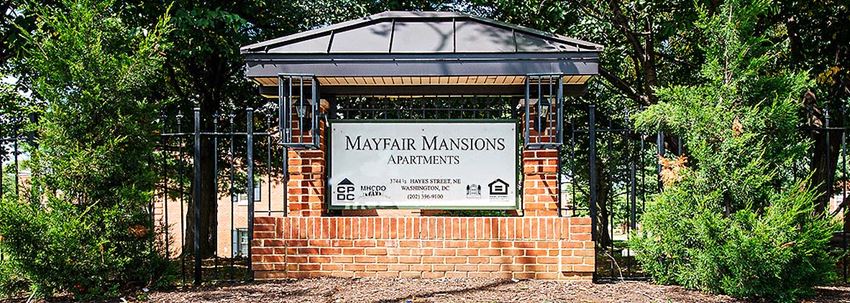 a sign is on the front of a brick building