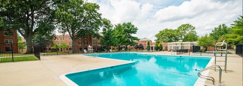 a swimming pool with a building in the background