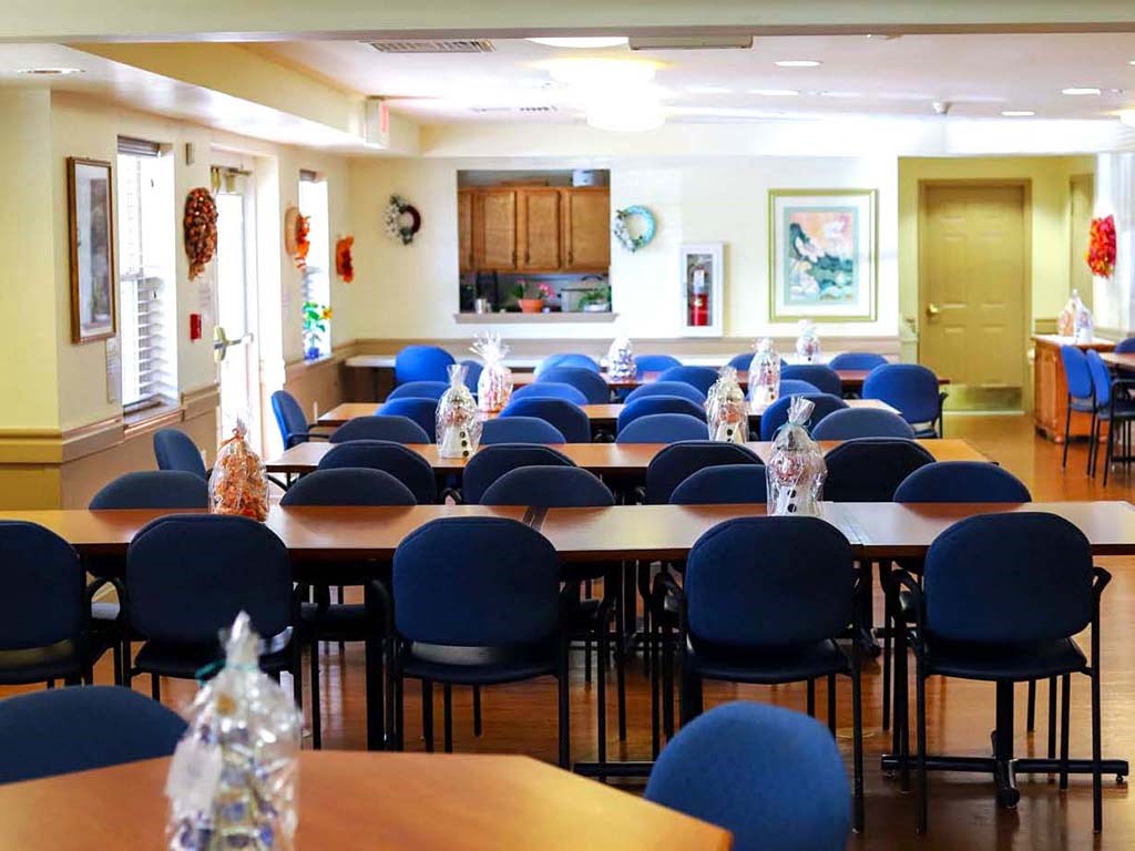 a conference room with tables and chairs in it