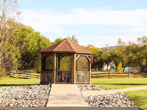 a gazebo in the middle of a park