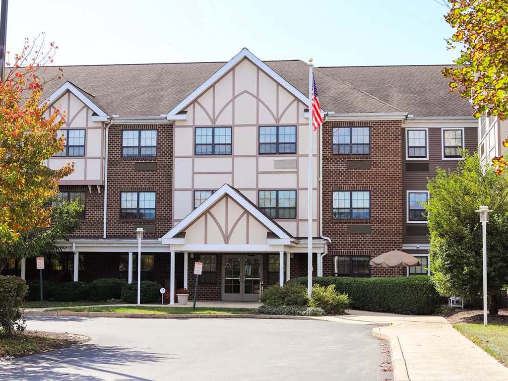 a large building with an flag in front of it