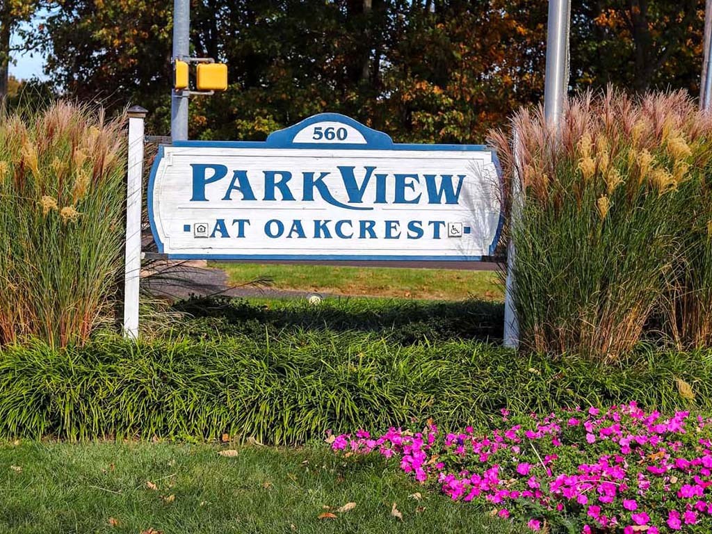 a park view sign in front of some flowers
