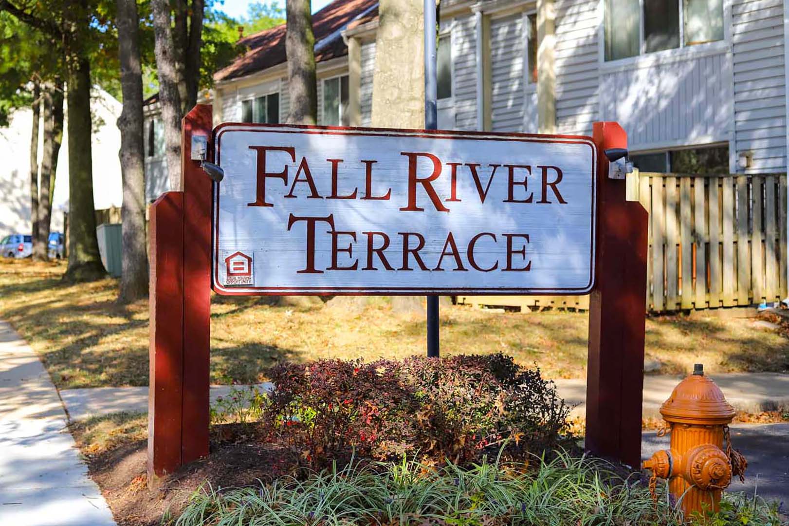 a sign for the fall river terrace in front of a house