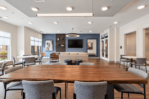 A conference room with a long table and chairs.