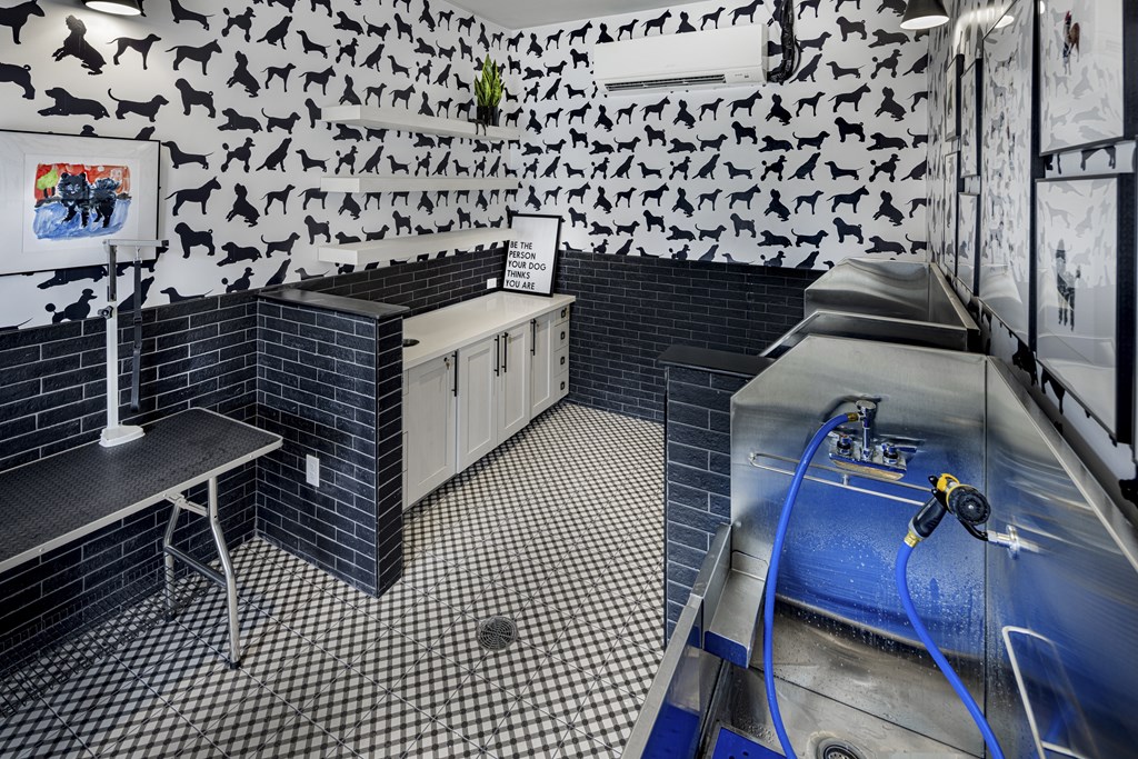 A black and white tiled bathroom with a sink and a shower at Folksong Apartments, Flowery Branch, GA