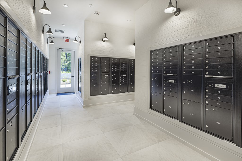 A long hallway with mailboxes on the wall at Folksong Apartments, Georgia