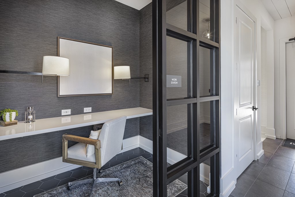 A modern bathroom with a chair and a mirror at Folksong Apartments, Flowery Branch, GA