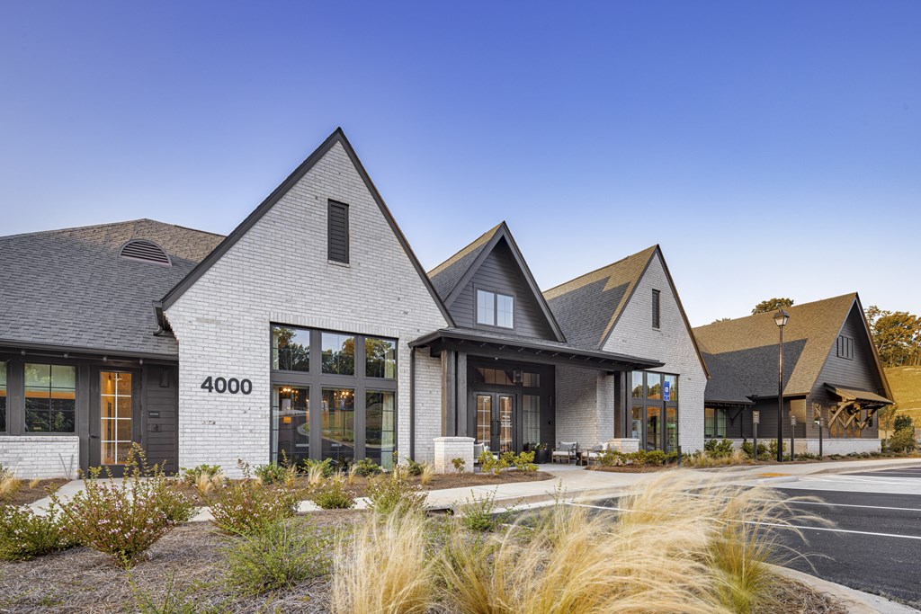 A modern house with a grey facade and a black roof at Folksong Apartments, Georgia