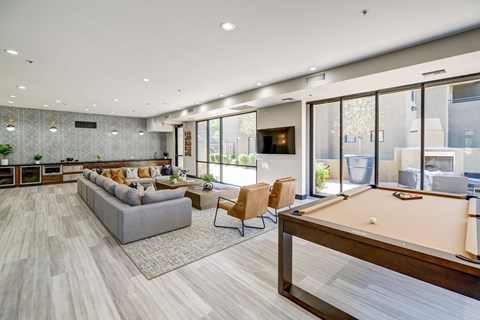 a large living room with a pool table