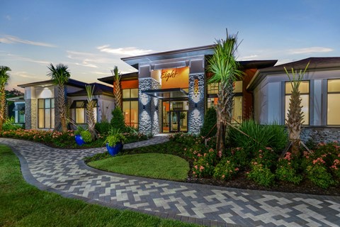 a rendering of the front of a building with palm trees