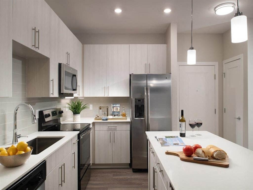 Kitchen with quartz countertops and stainless steel appliances