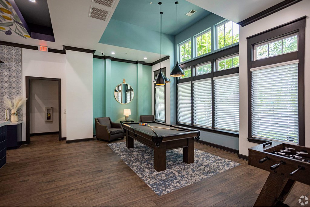 a game room with a pool table and large windows at Grand Oak at Town Park, Smyrna, 37167