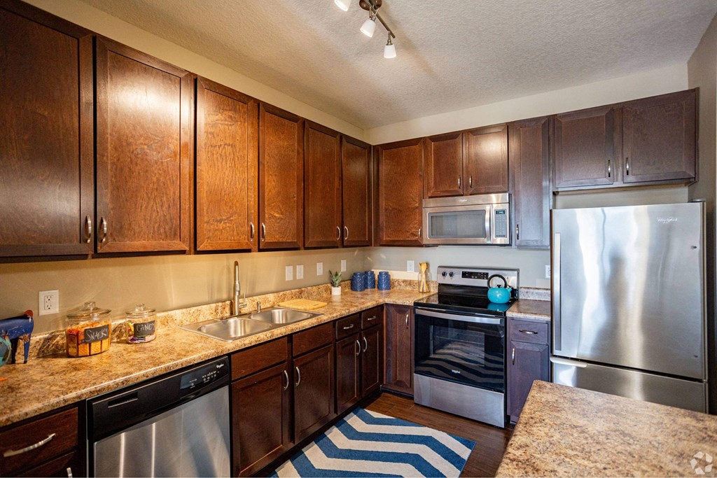 full kitchen with stainless steel appliances and granite counter tops at Grand Oak at Town Park, Smyrna, TN, 37167