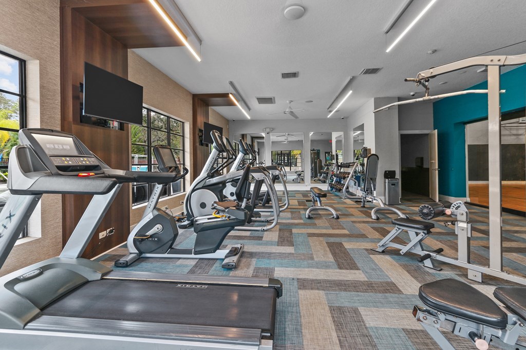 The Preserve at Westchase Apartments fitness center with cardio machines